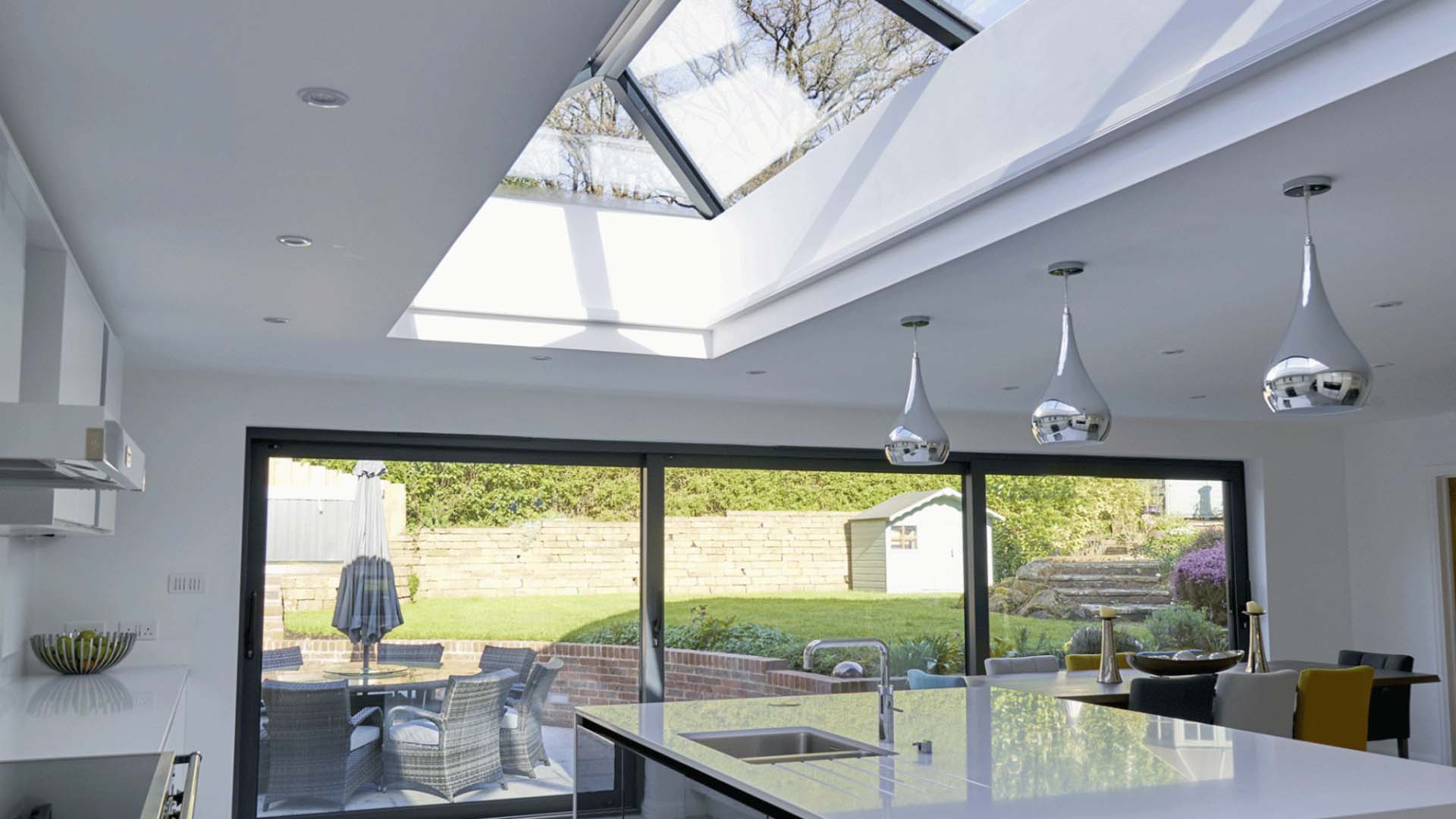 steel lights hanging in the conservatory