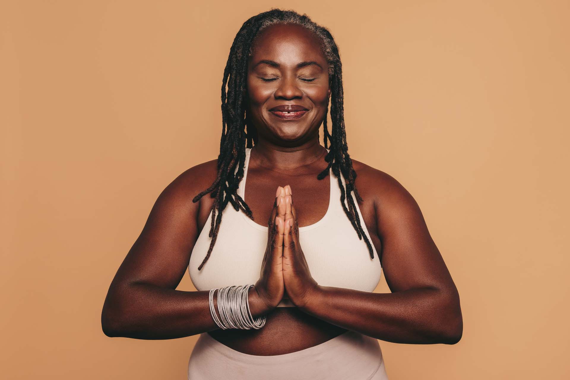 Woman practising yoga, which is great for the mind and the body