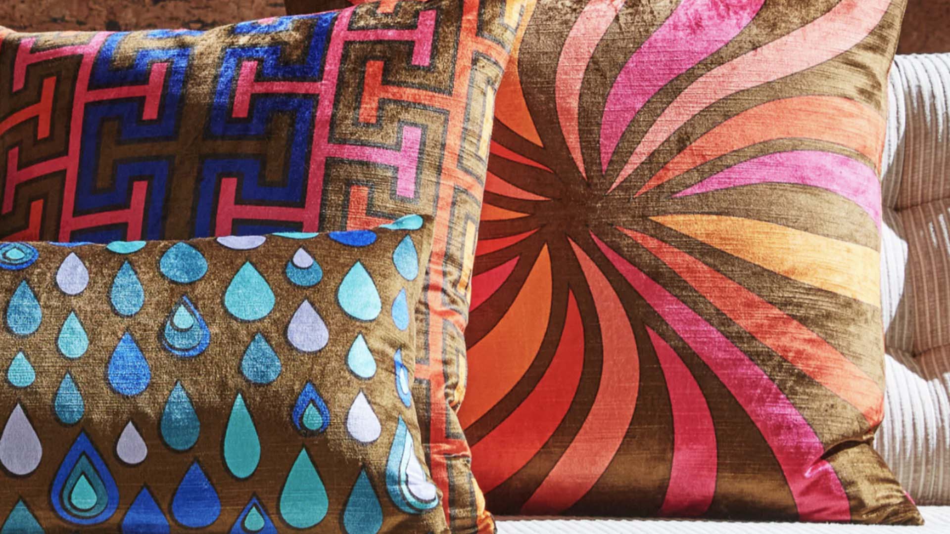 Bright cushions by designer Jonathon Adler