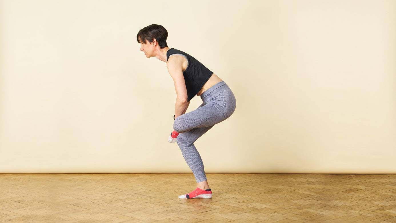 Woman doing a glute stretch