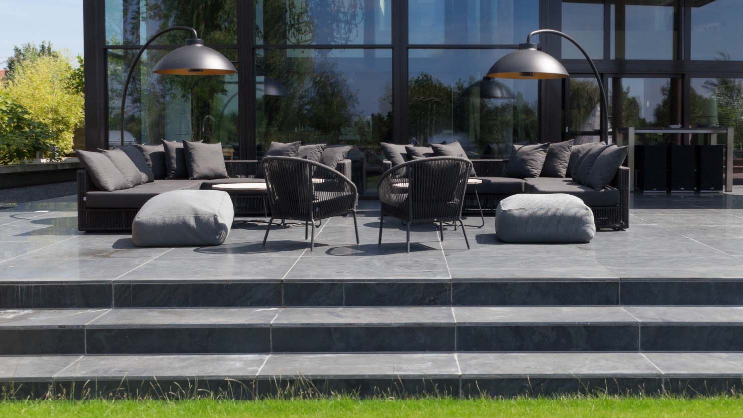 Wide steps leading up to a tiered patio