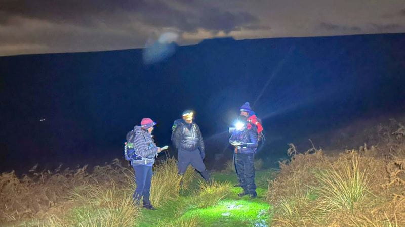 Night time hikers with their torches