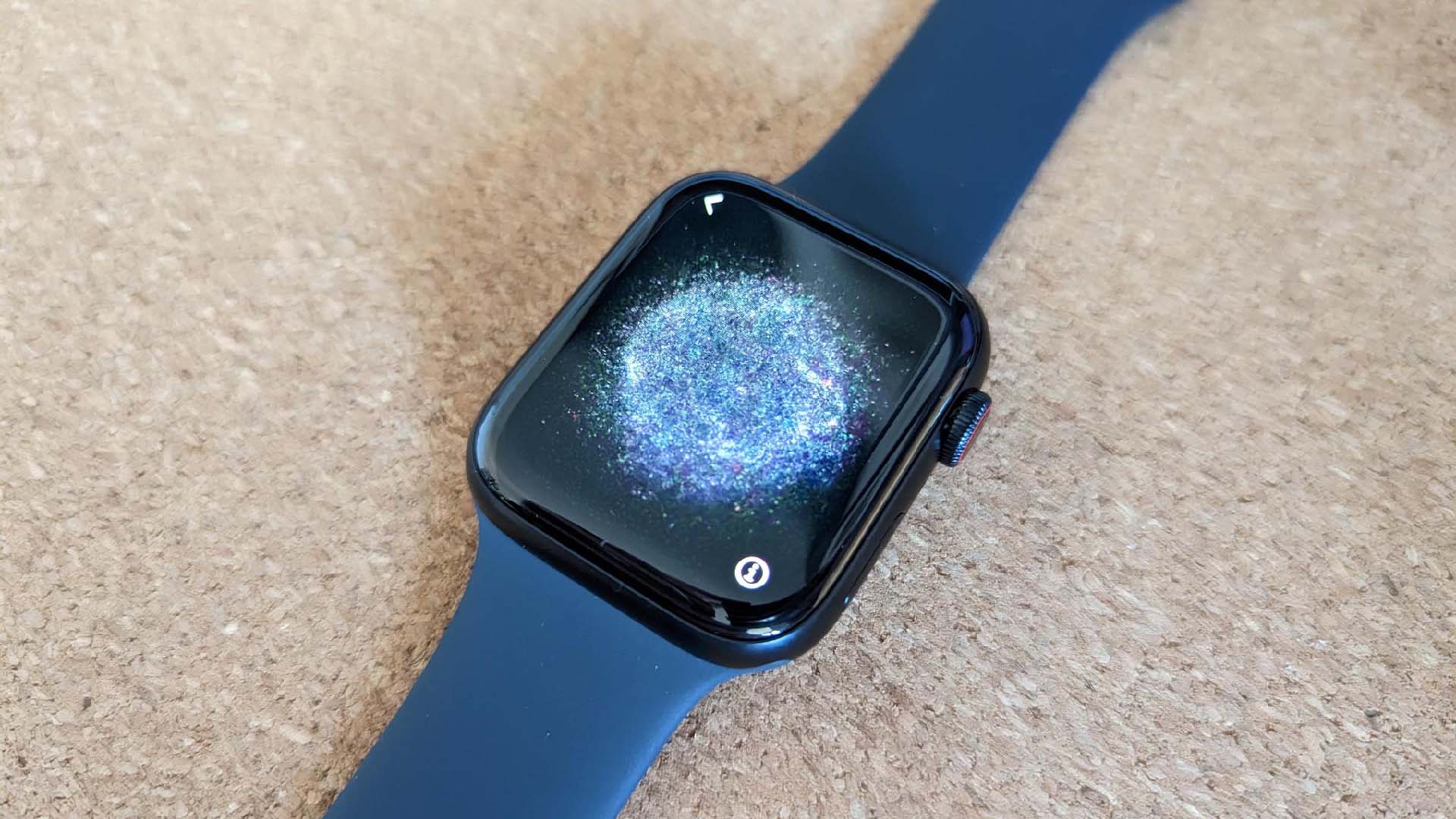 An Apple watch with a blue strap
