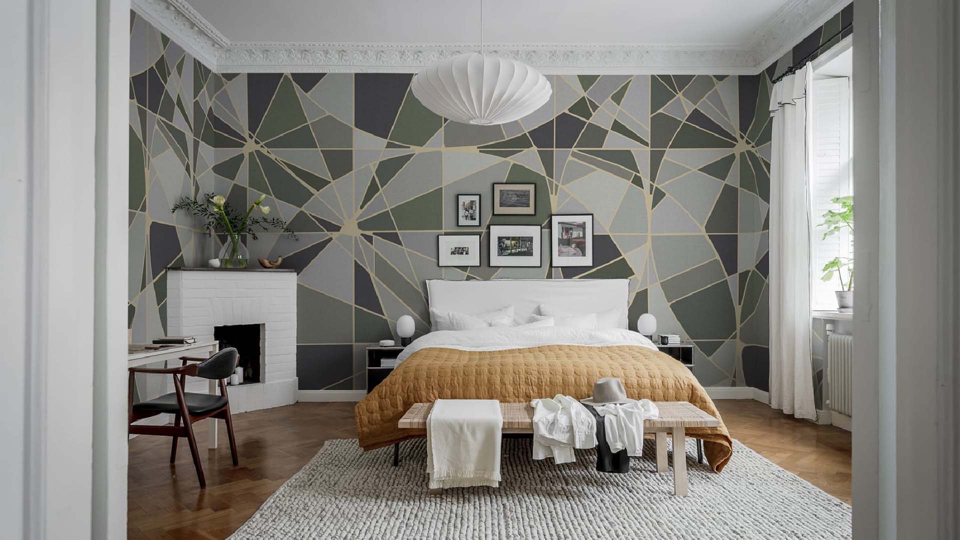 Green wallpaper behind bed