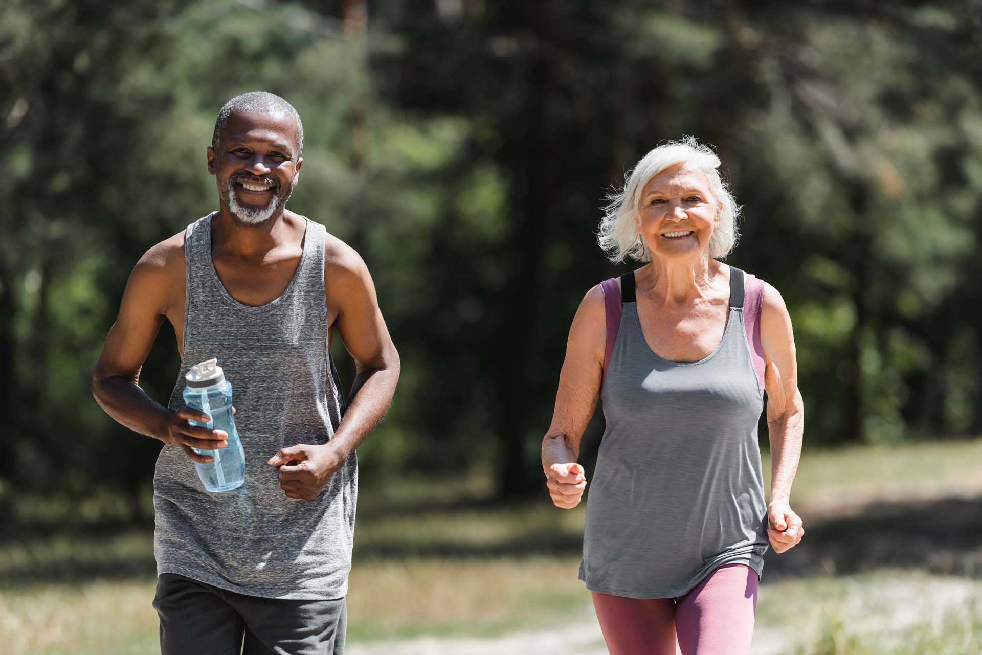 Two runners enjoying the warm weather, running together