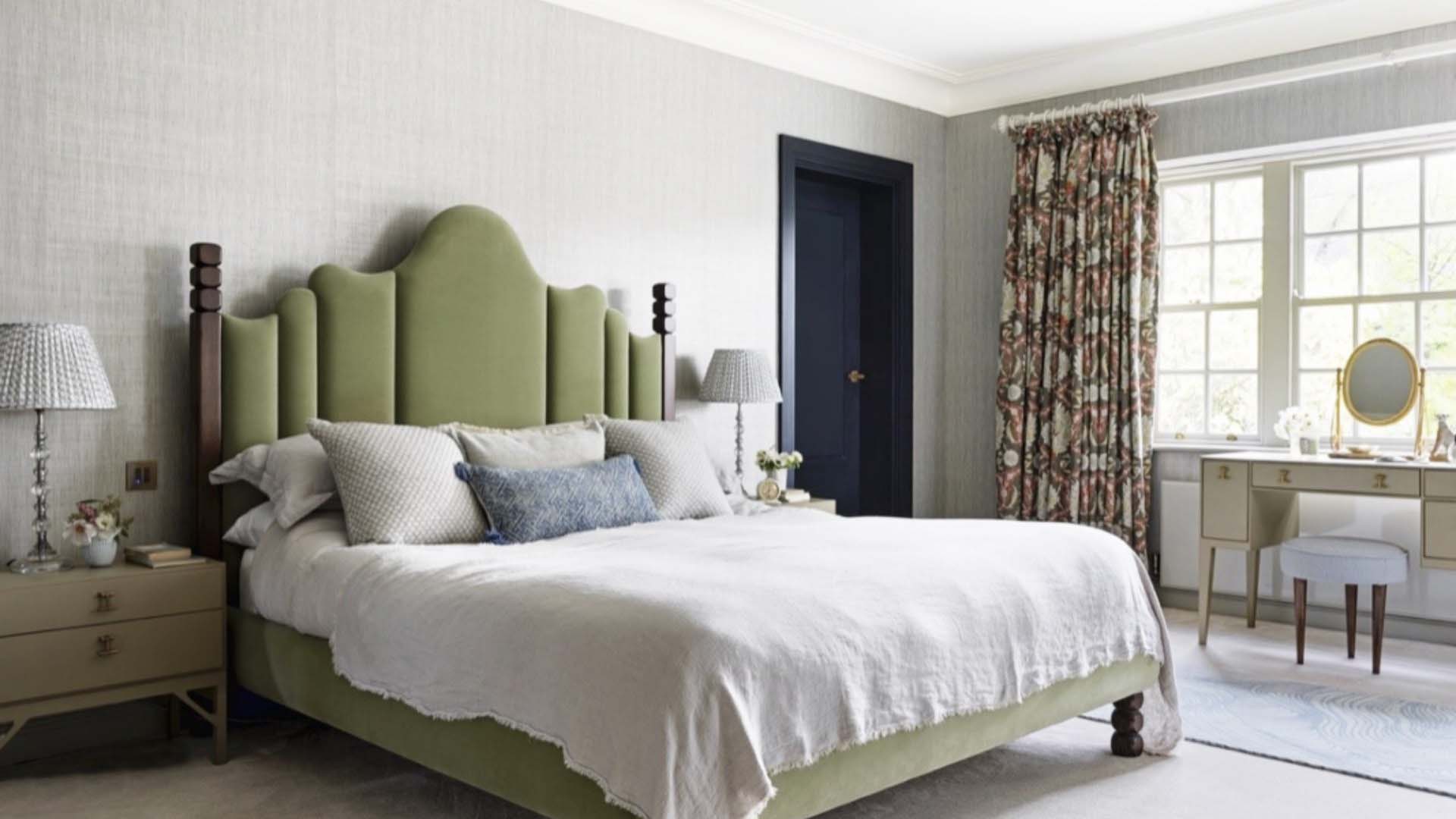 Bedroom with bed featuring green headboard