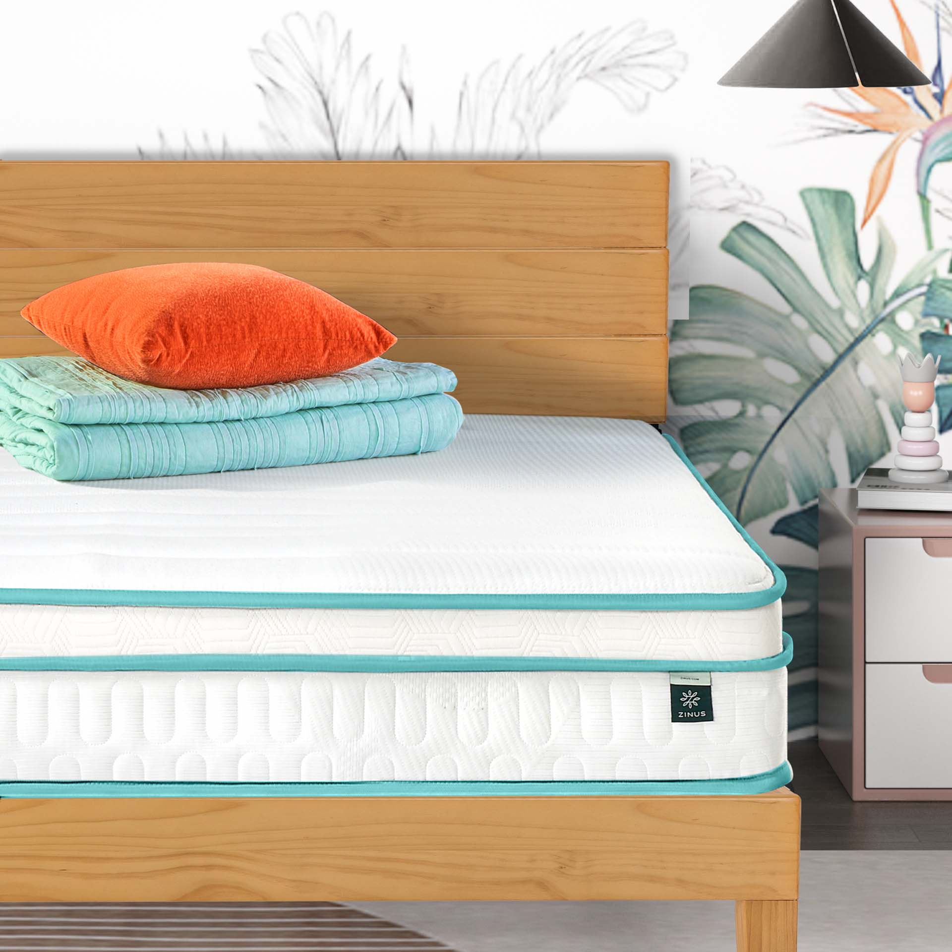 A bed with an uncovered mattress