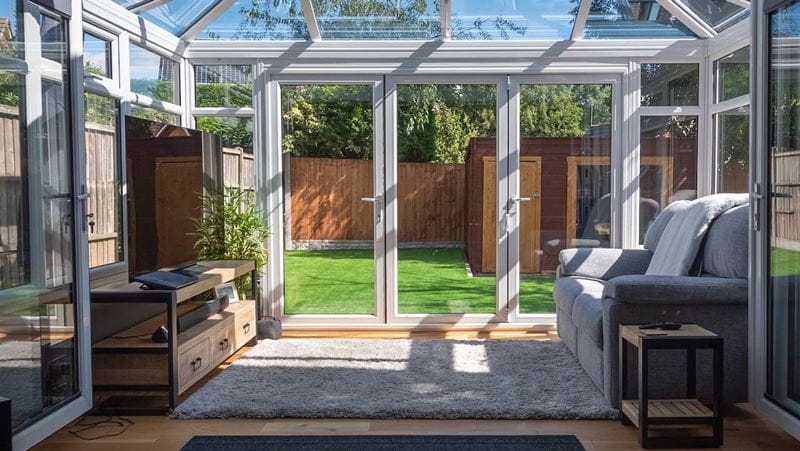 Sofas and tv in a conservatory