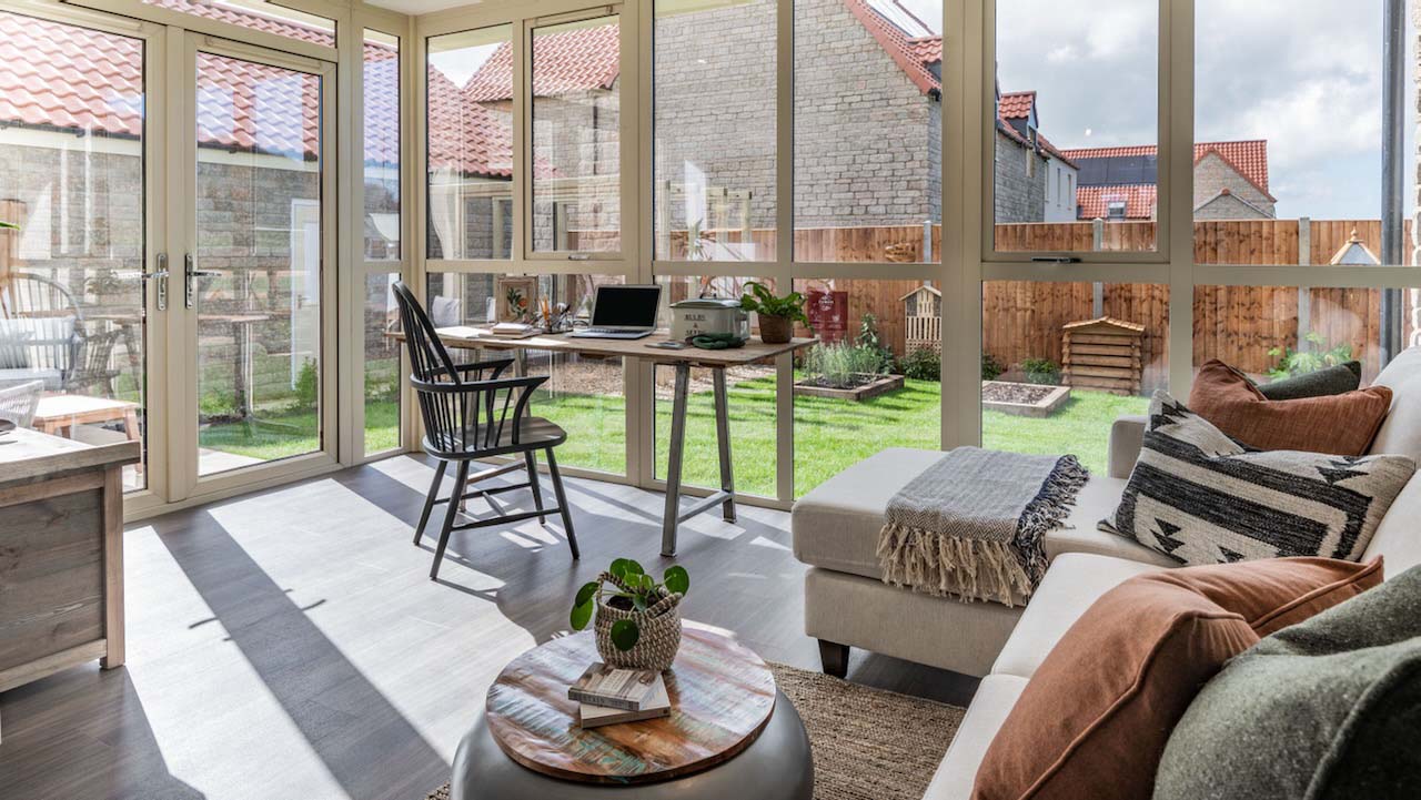 sofa in the conservatory with sunlight beaming in