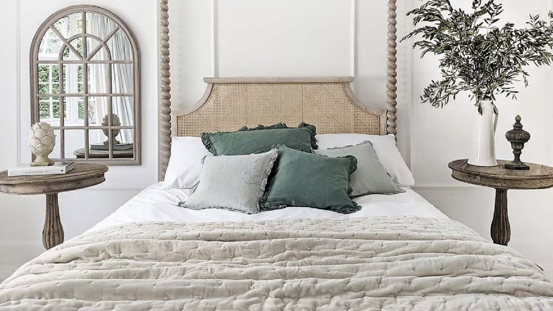 Luxurious bed with green pillows