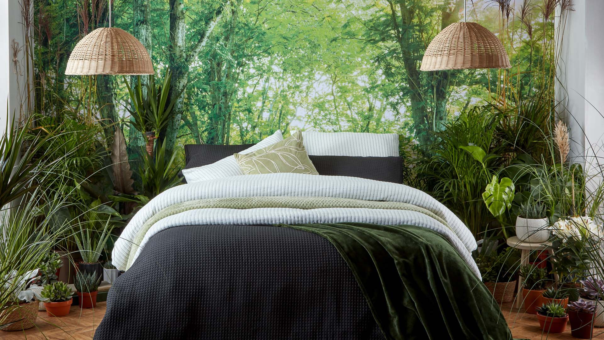 Plants around a bed in a bedroom