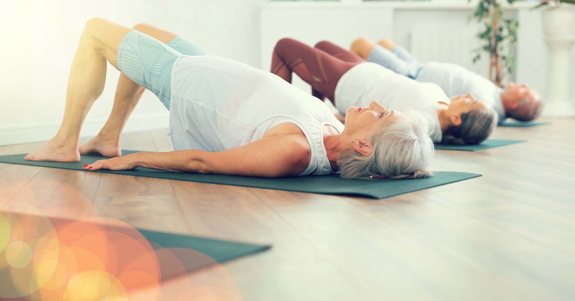 A group of women doing bridge pose