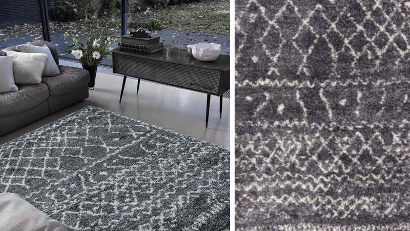 A black statement rug in a modern living room