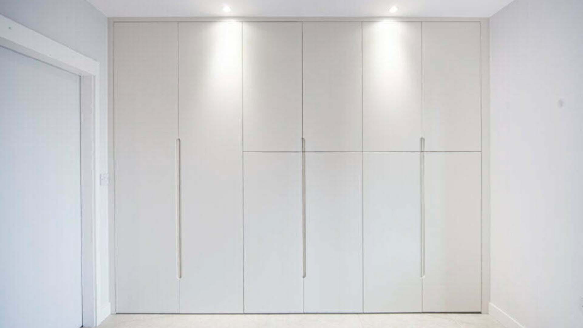 built in wardrobe concealed in the hallway 