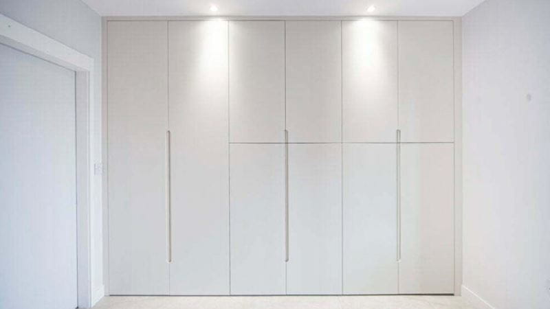 built in wardrobe concealed in the hallway
