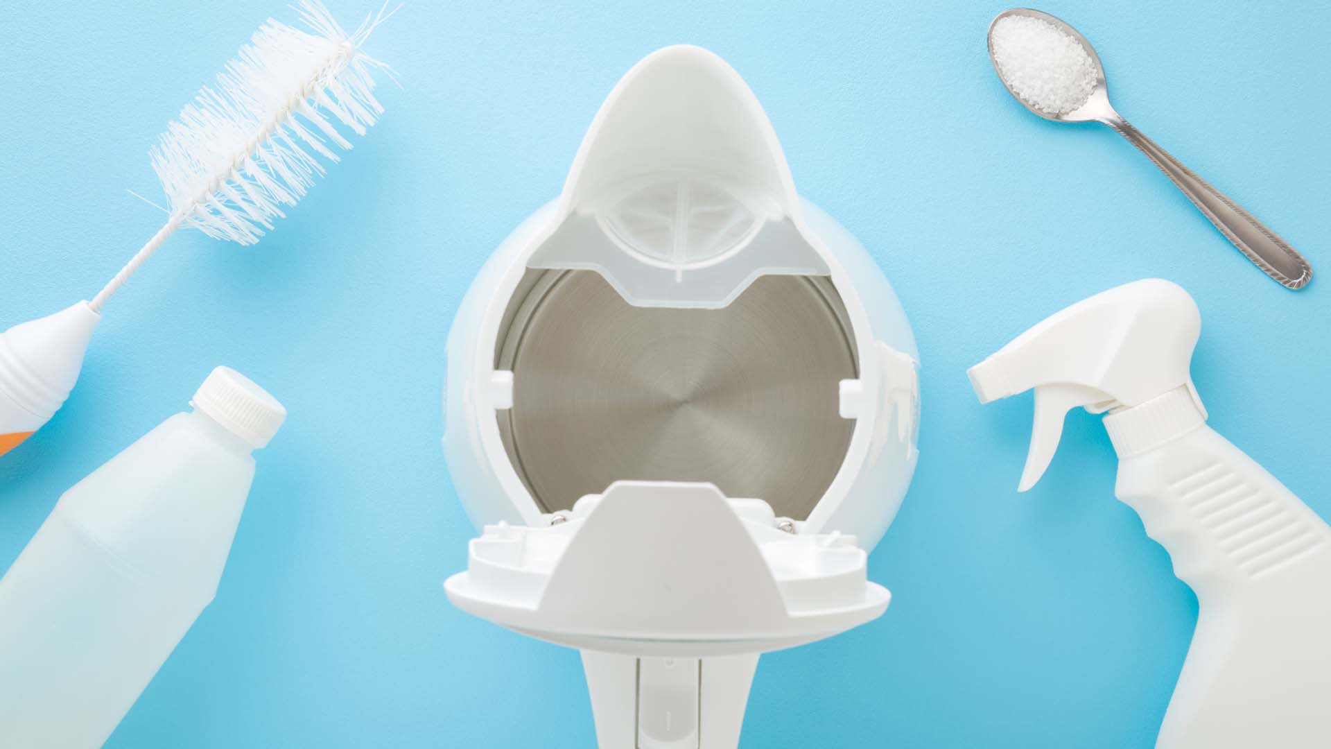 brush spoon and spray around a kettle ready to descale