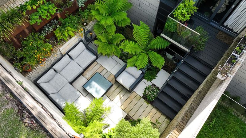 shady courtyard with seating and shrubs