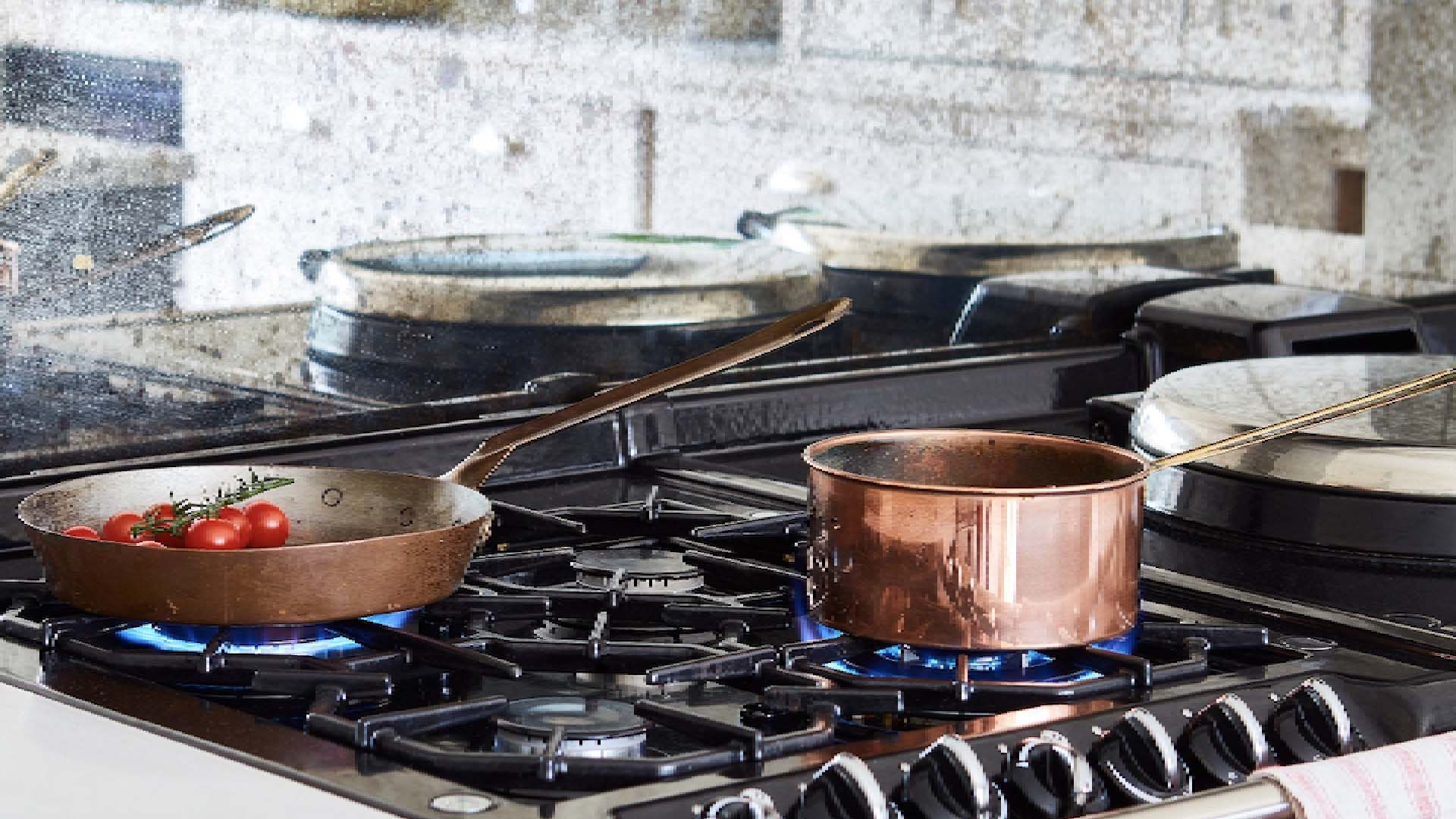 Copper pans on stove