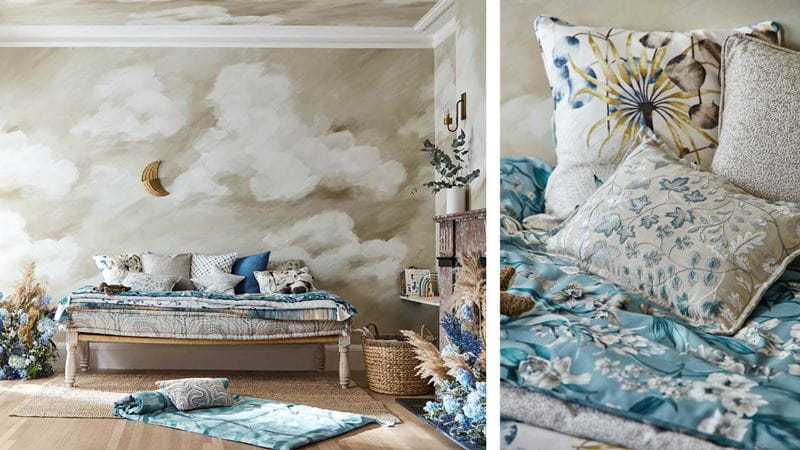 A bedroom with a scyscape wall mural that looks like clouds in the sky, next to a close-up of patterned cushions.