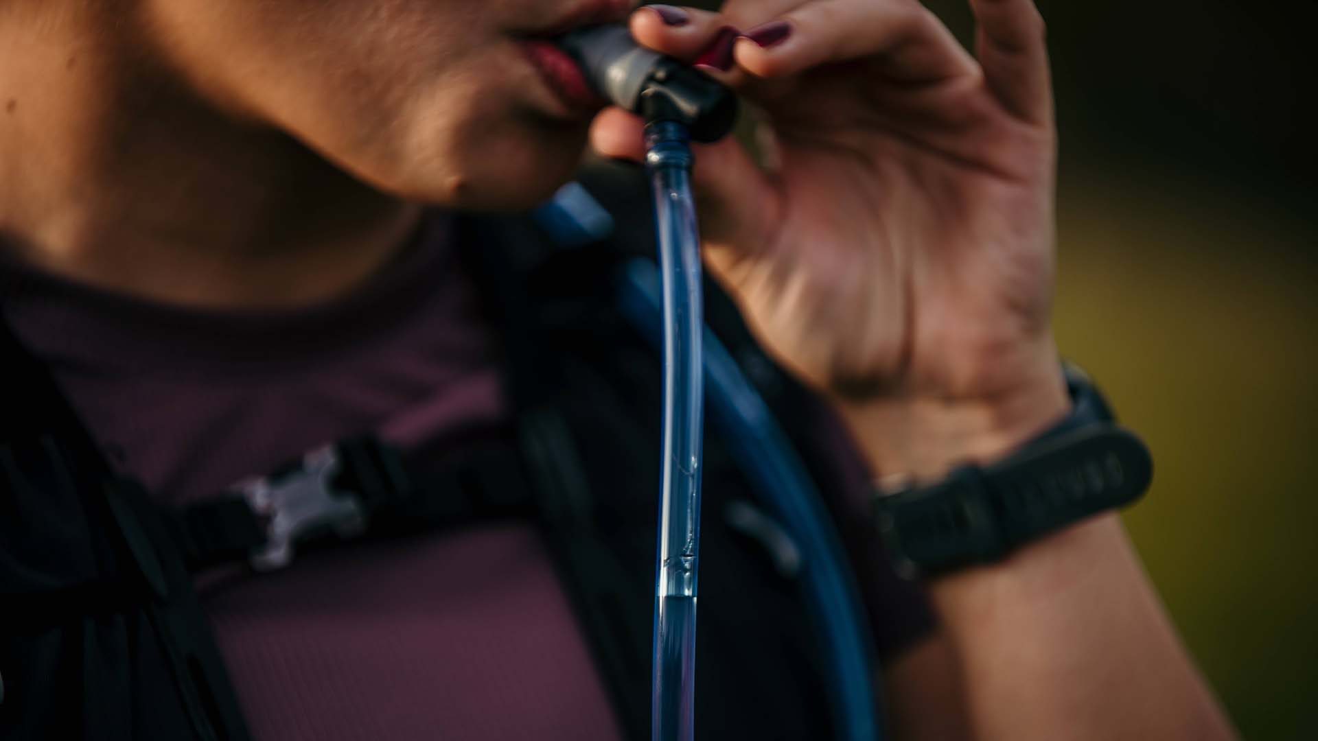 someone drinking through a straw