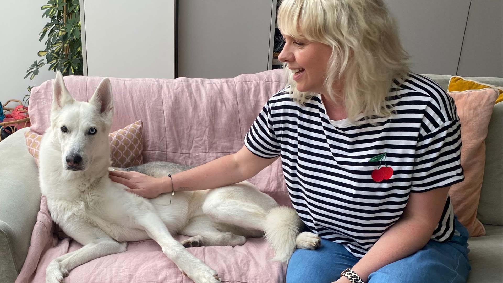 Woman with dog on a sofa