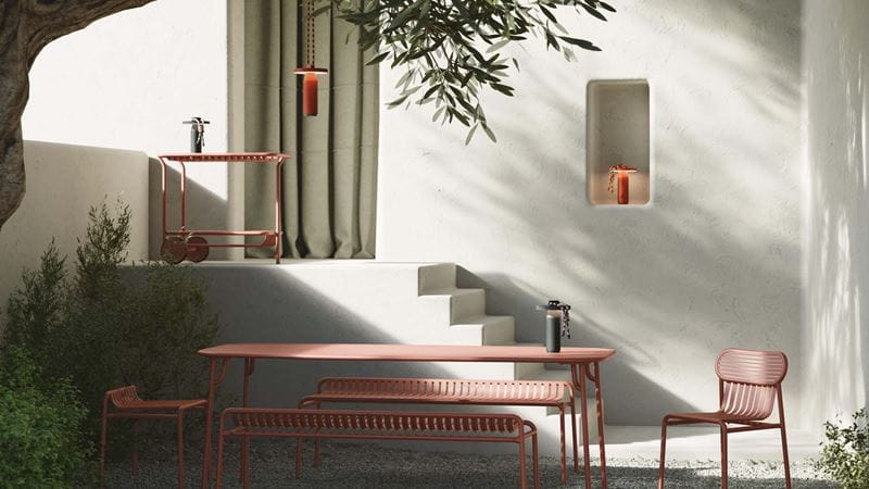 Outside wall painted white to brighten it up for the table and chairs