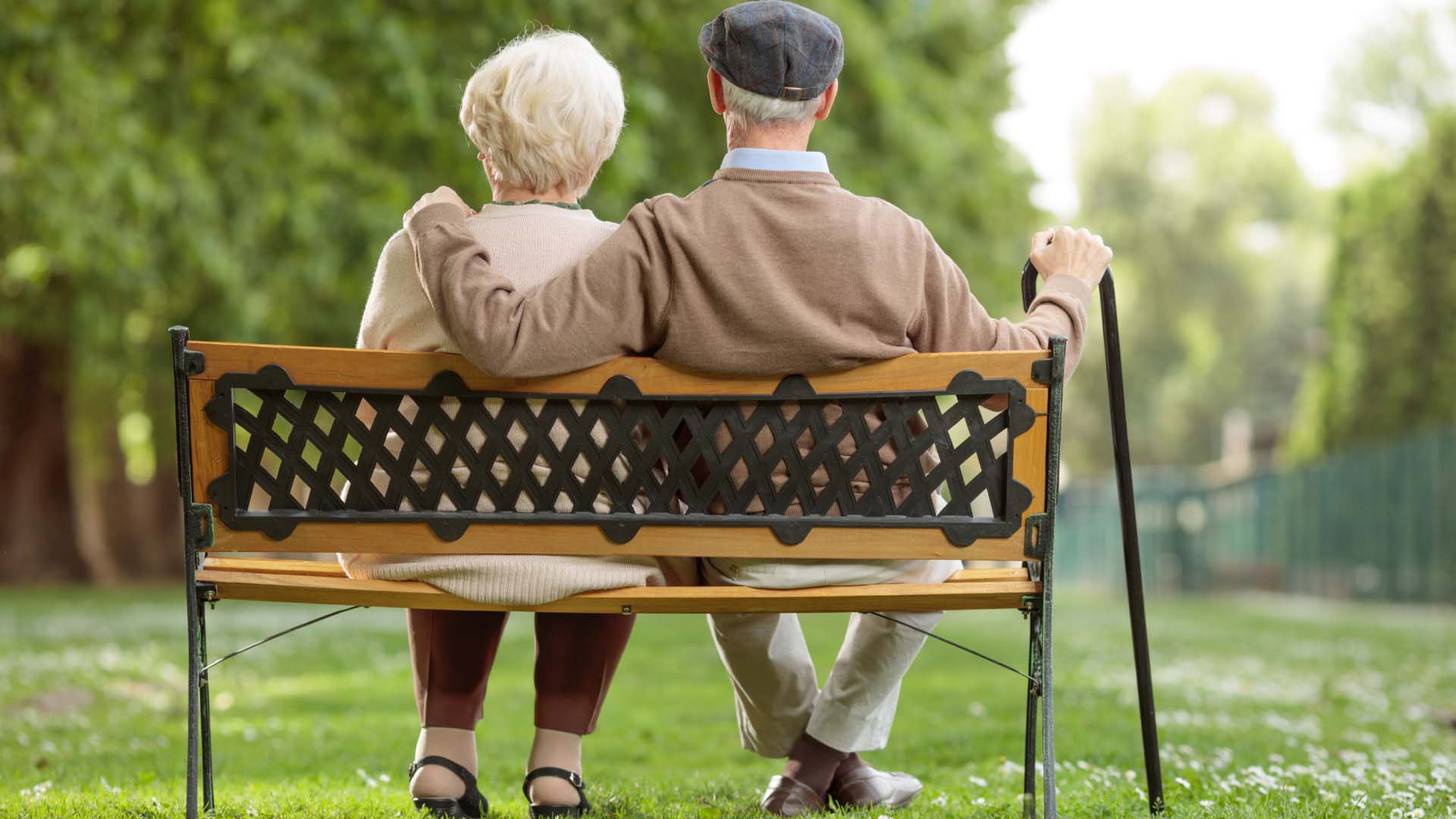 older couple sat on a bench relaxing
