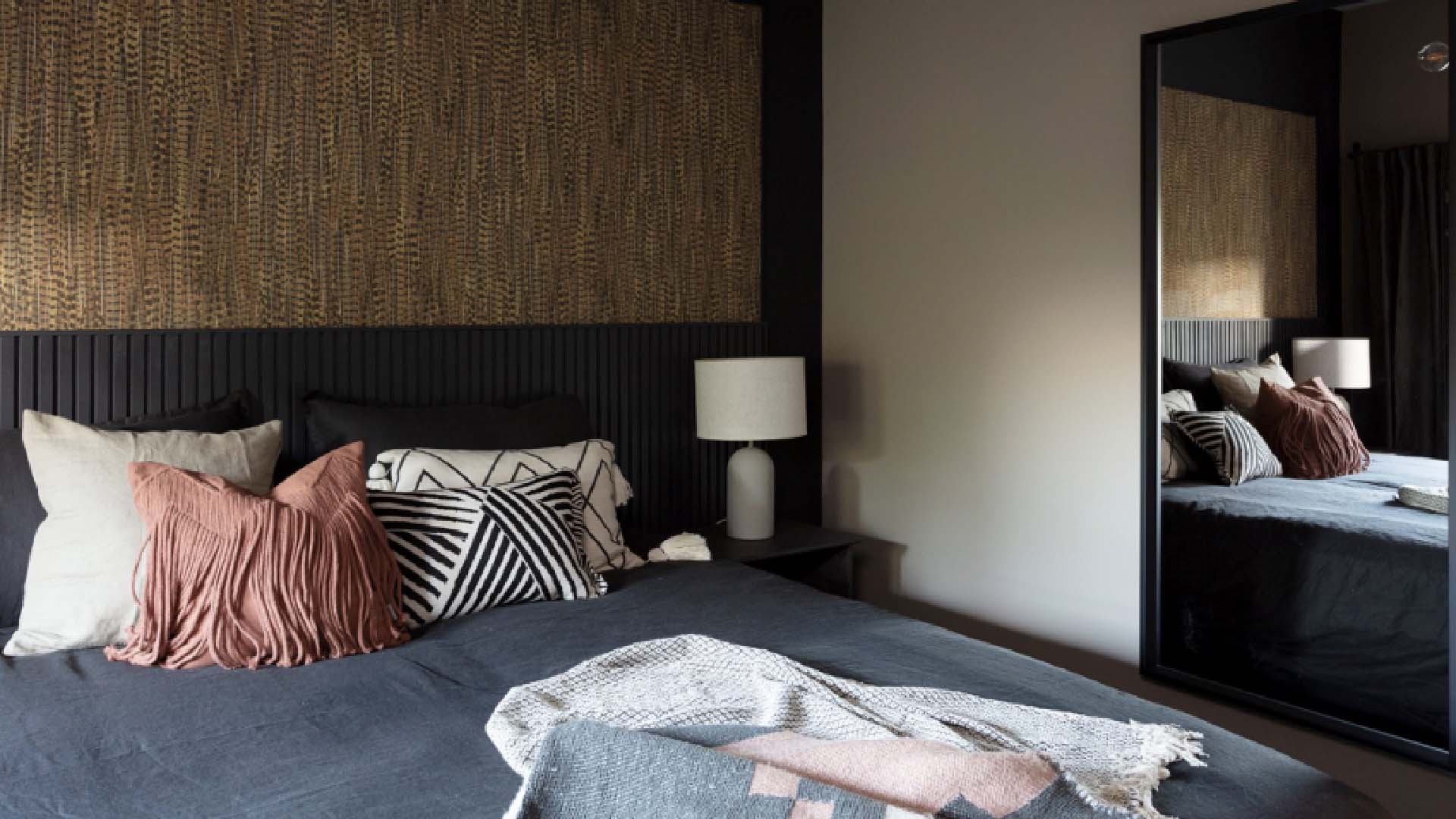 bedroom with big mirror for space