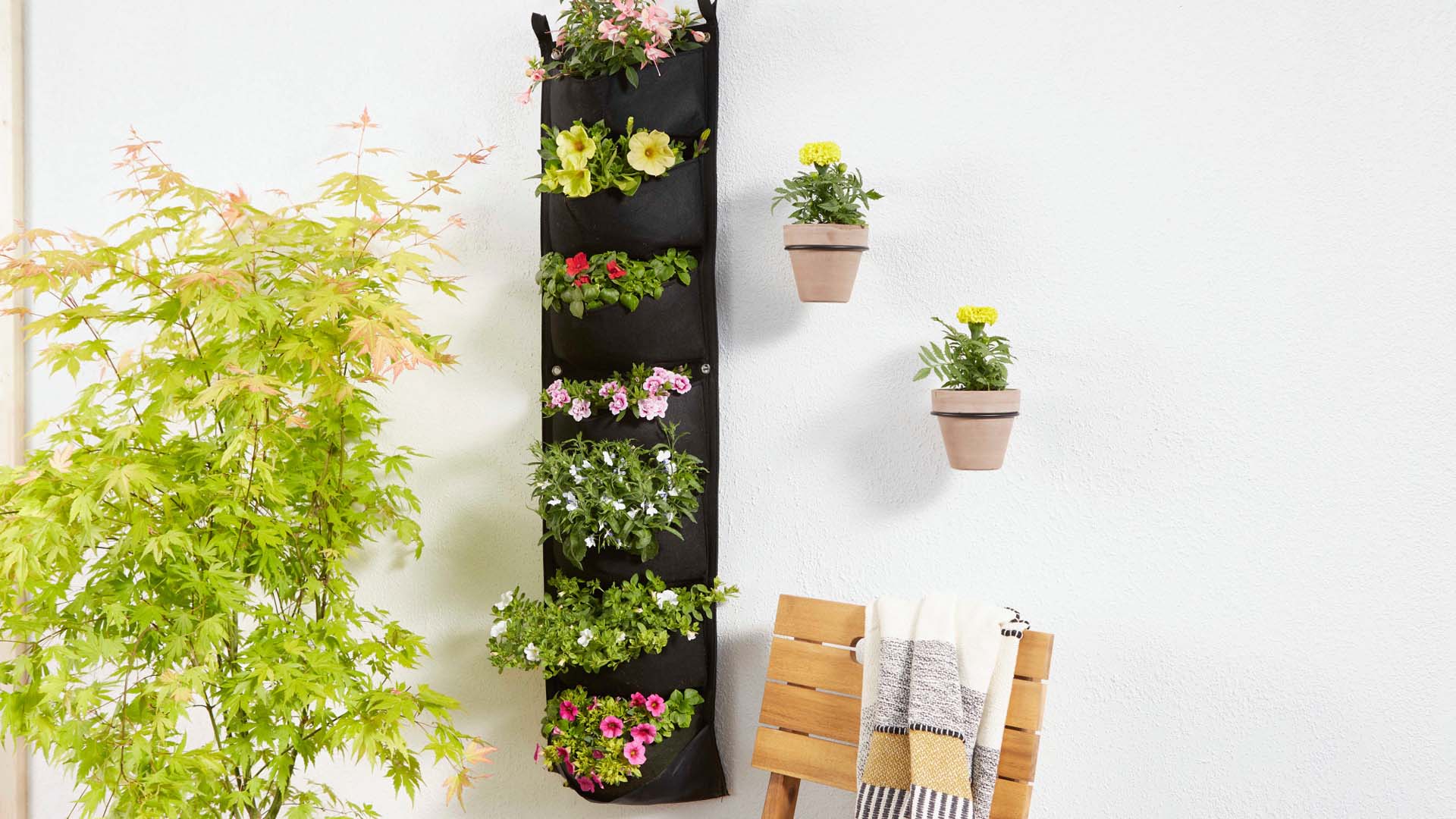 A vertical planter filled with plants