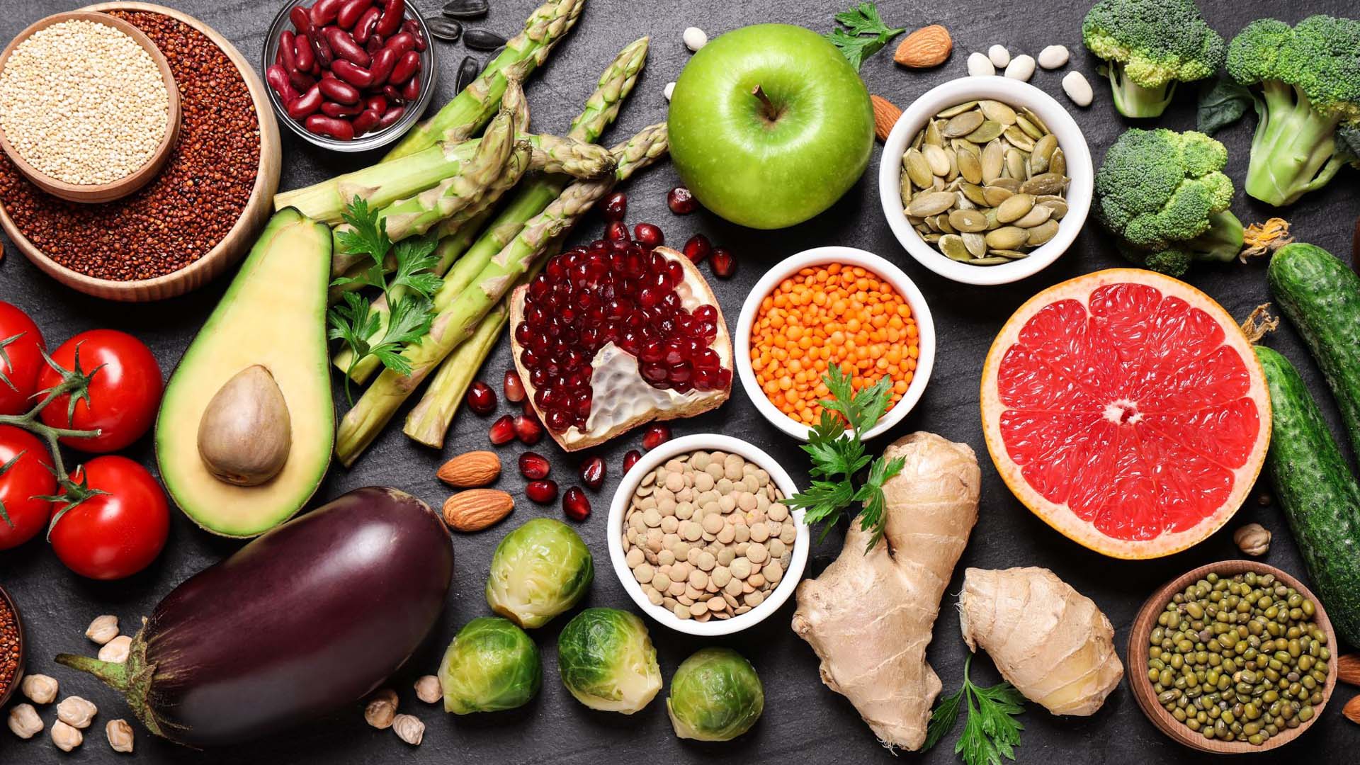 An spread on a table of healthy foods, vegetables and fruit