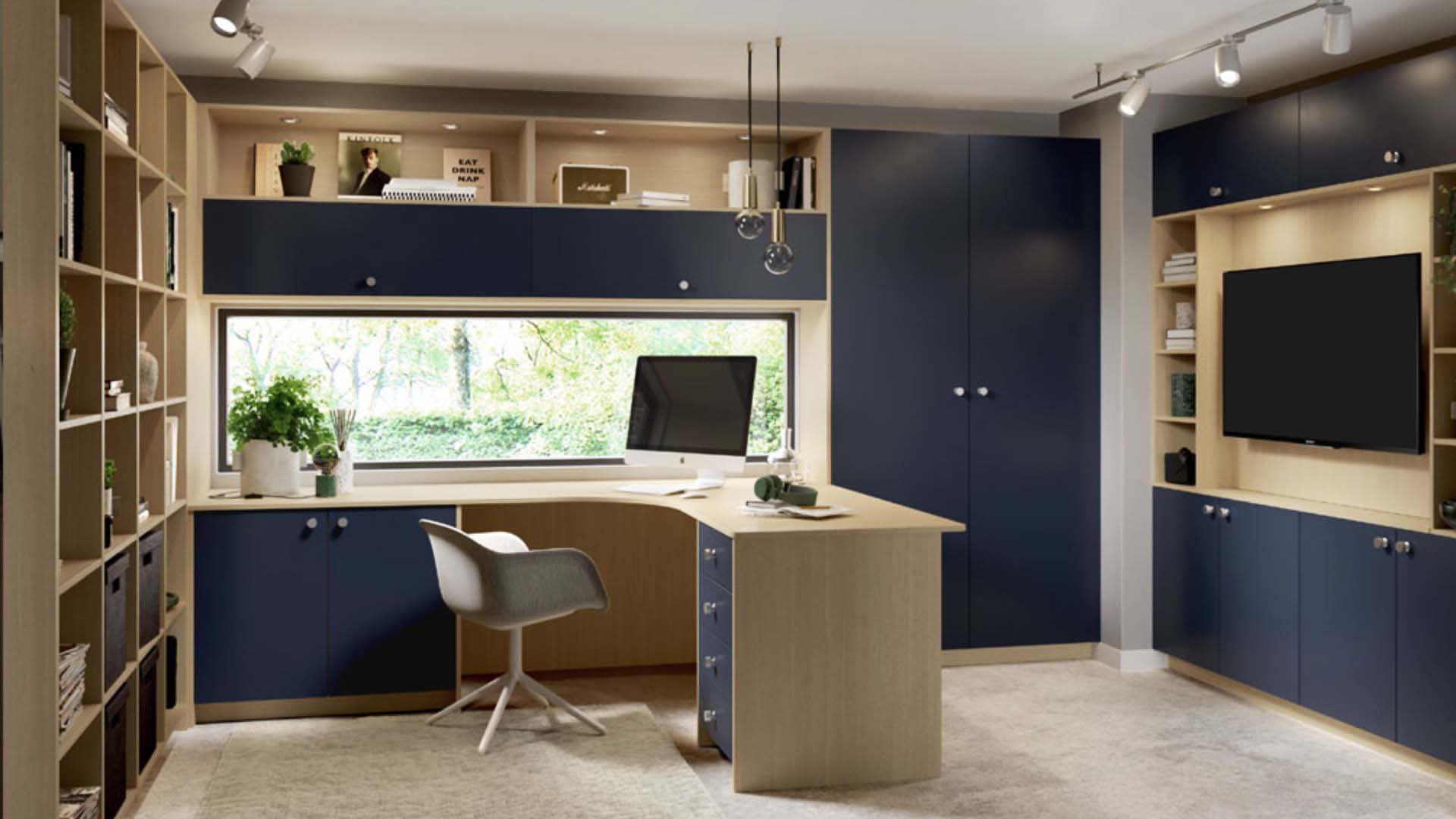 gorgeous built in office with large tv and window