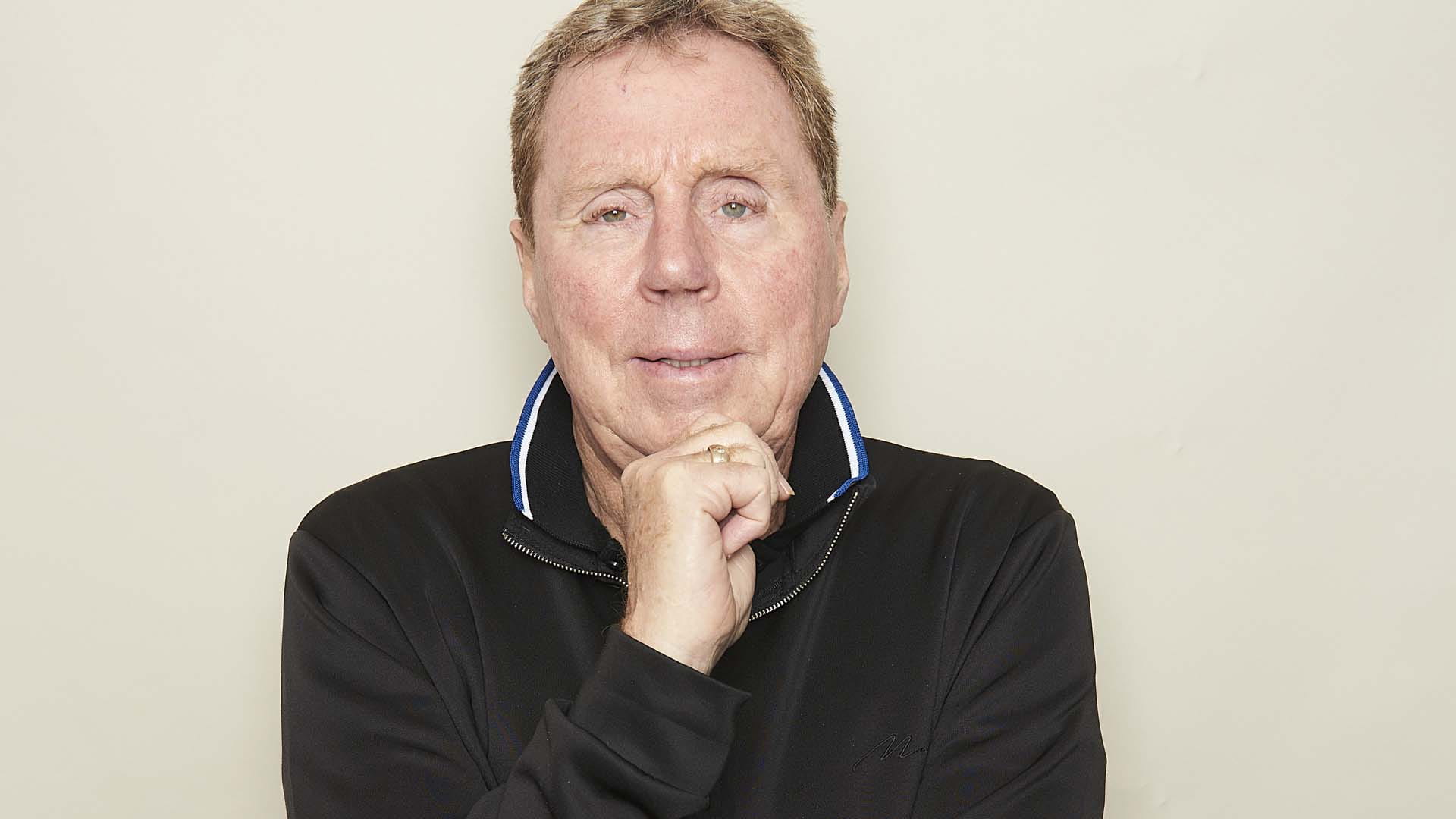 a close up of Harry Redknapp in a blue top