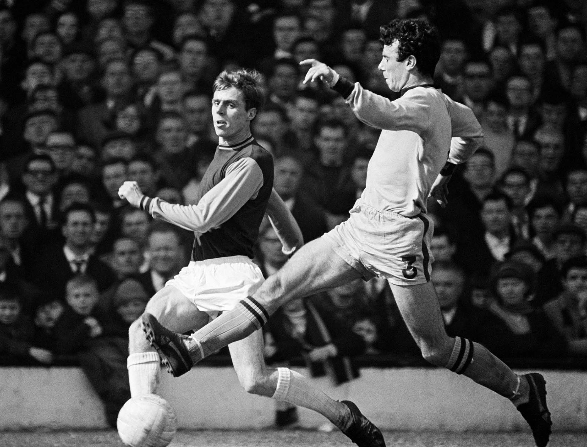 A black and white photo of Harry Redknapp playing football