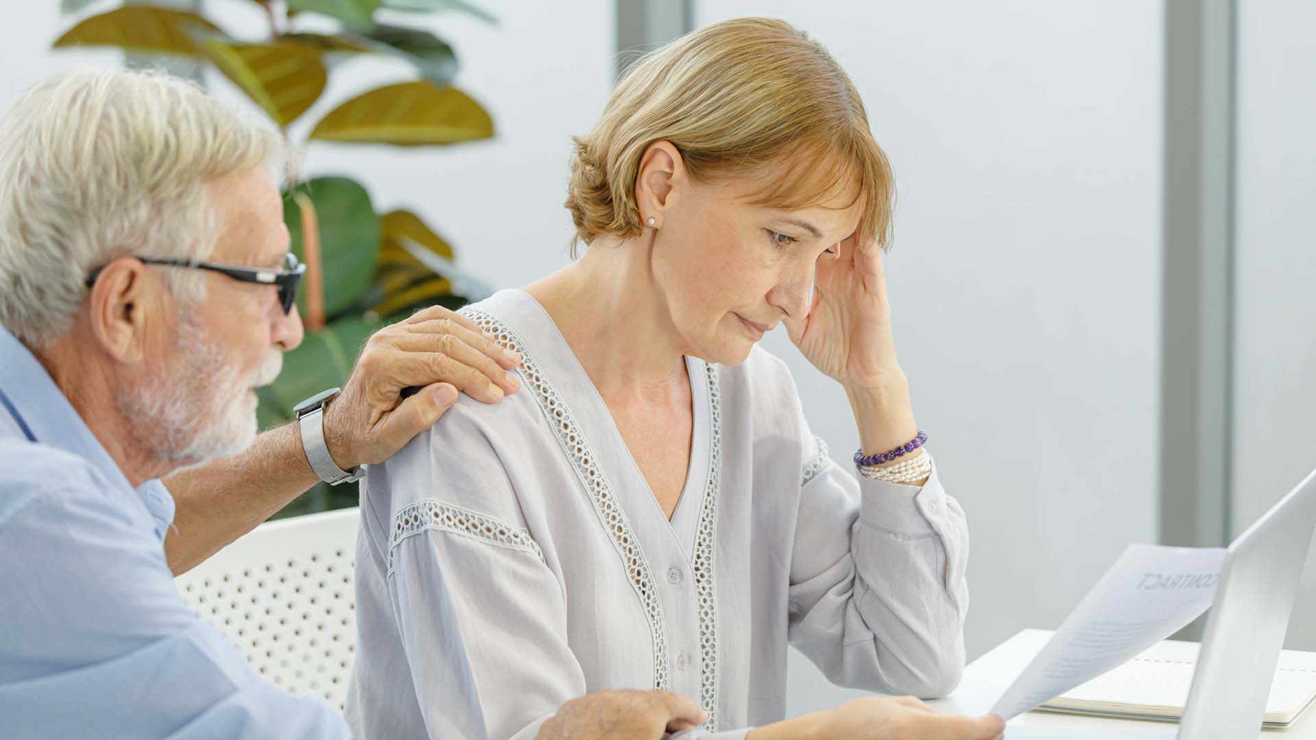 A man consoling a sad woman
