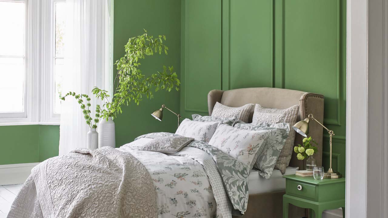 rectangular green panels above a bed
