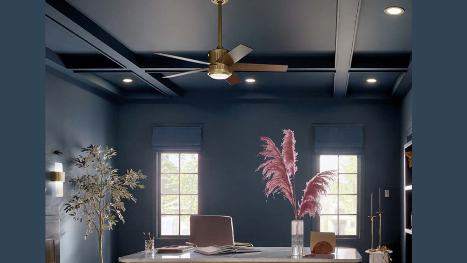 Gold fan in a teal blue room above the desk