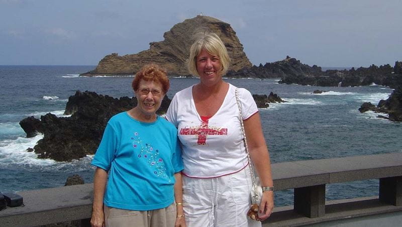 Julie and Brenda in front of a dramatic sea