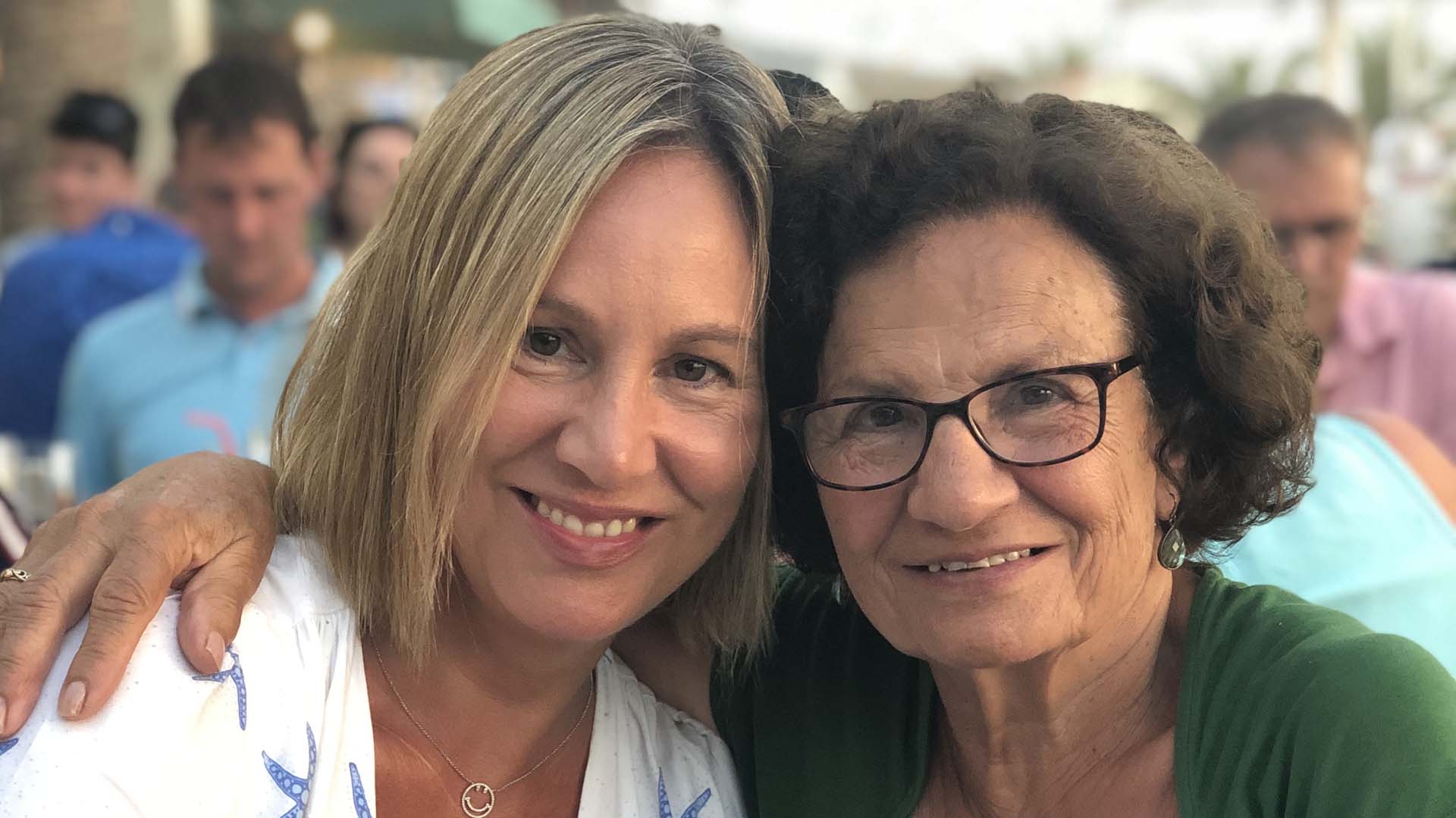 Mother and daughter smiling