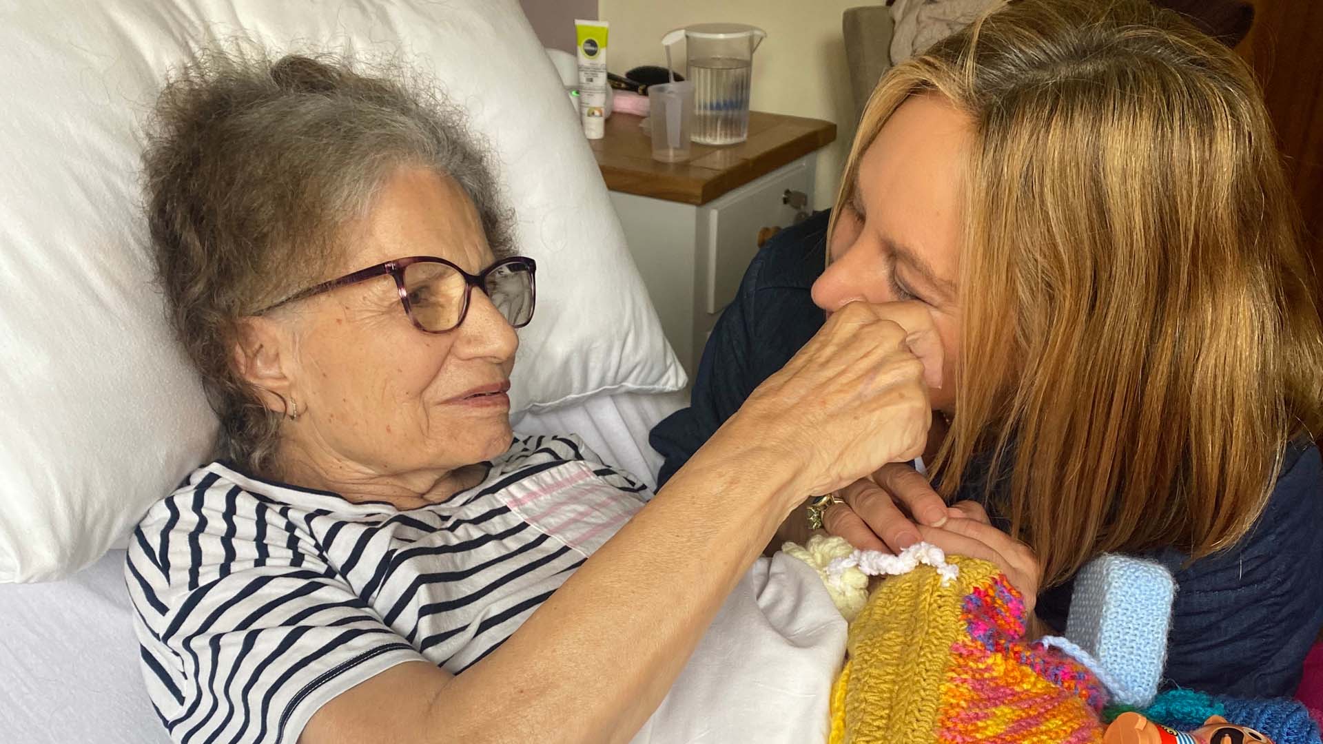 Marianne's mother stroked her face from her bed