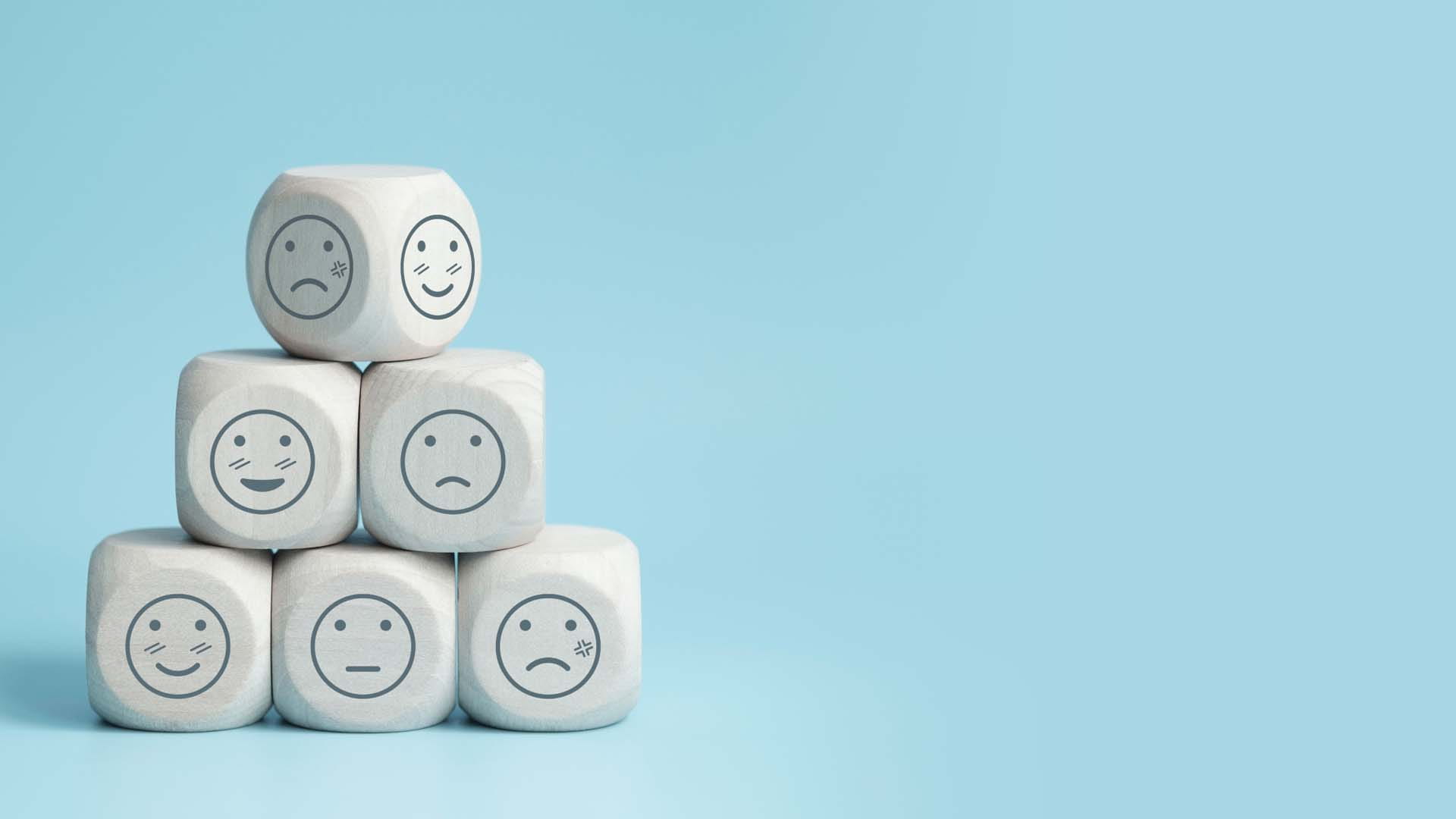 6 dice with different emotions shown on them