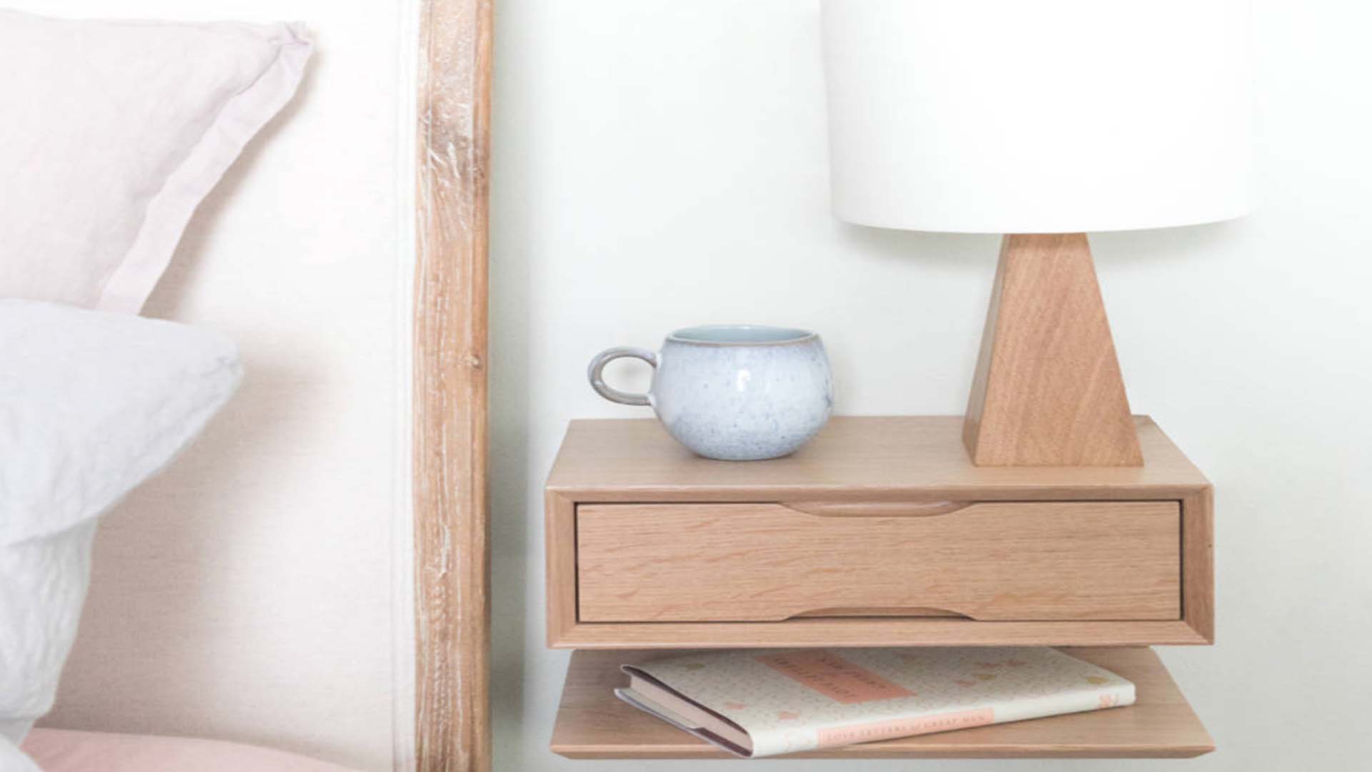 Bedside table with lamp and cup