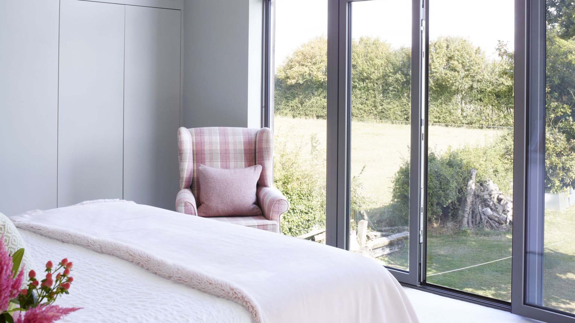 Bed looking out the floor to ceiling windows