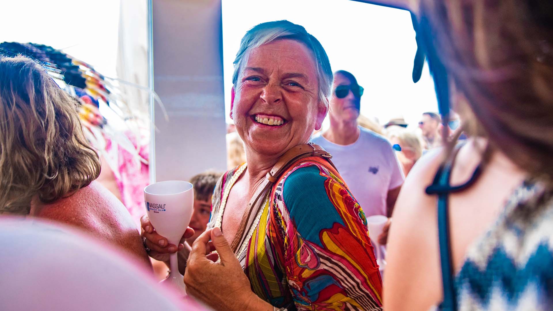 A clubber smiles at the camera