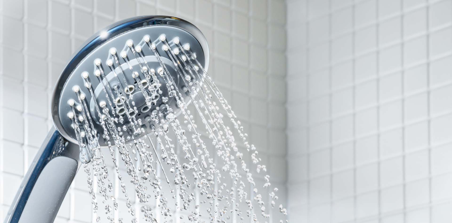 A shower head spraying water