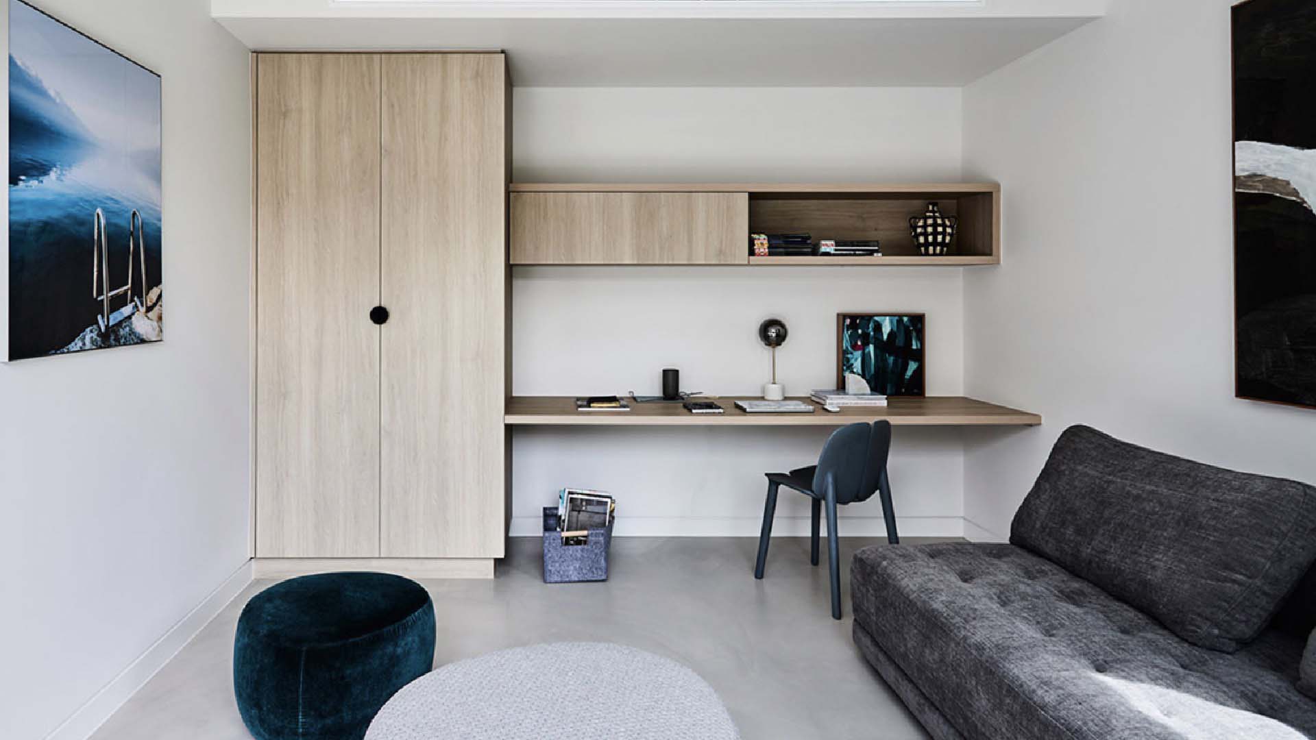 grey sofa bed in a simple grey office