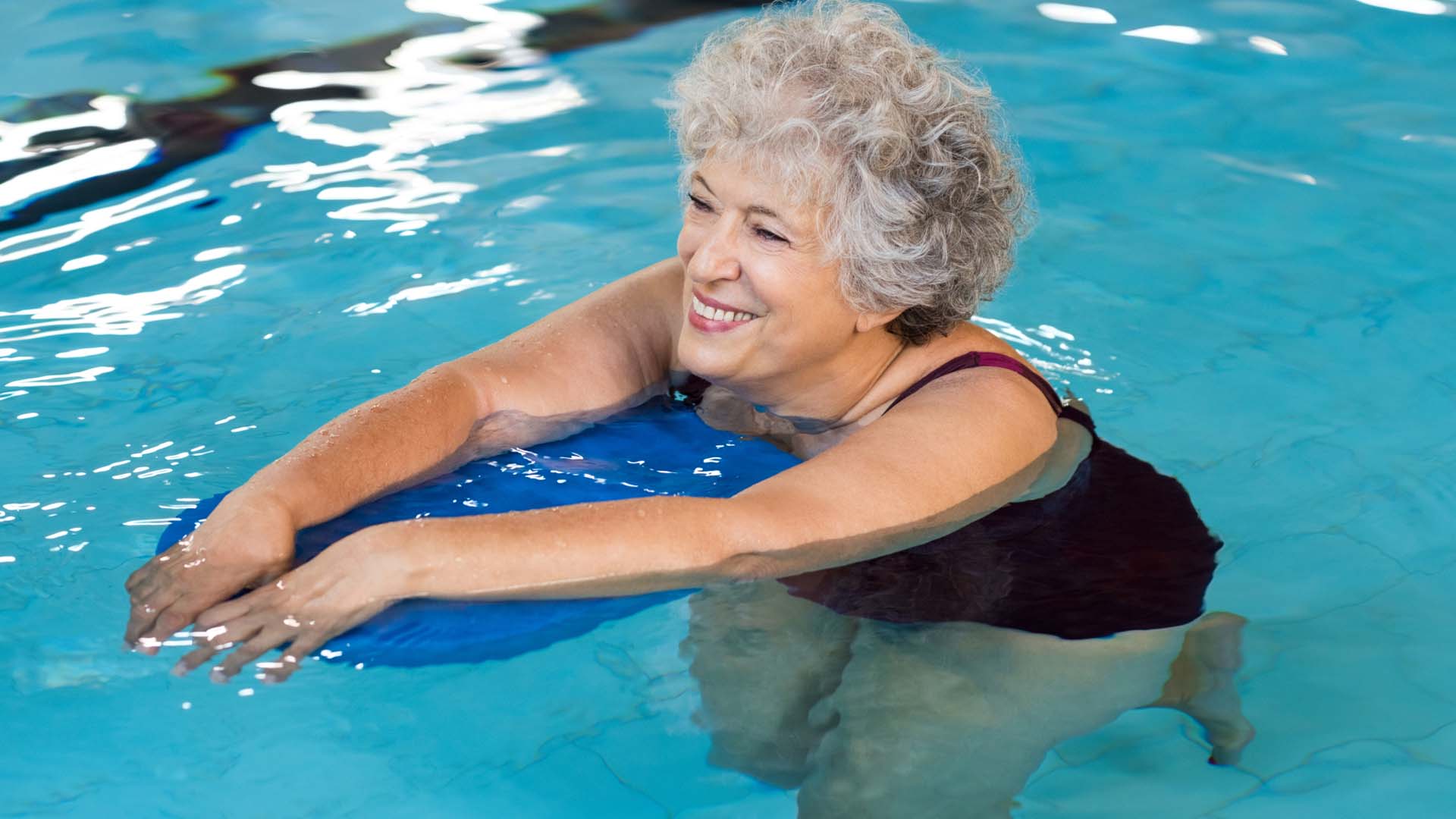 woman in the pool with a floatie
