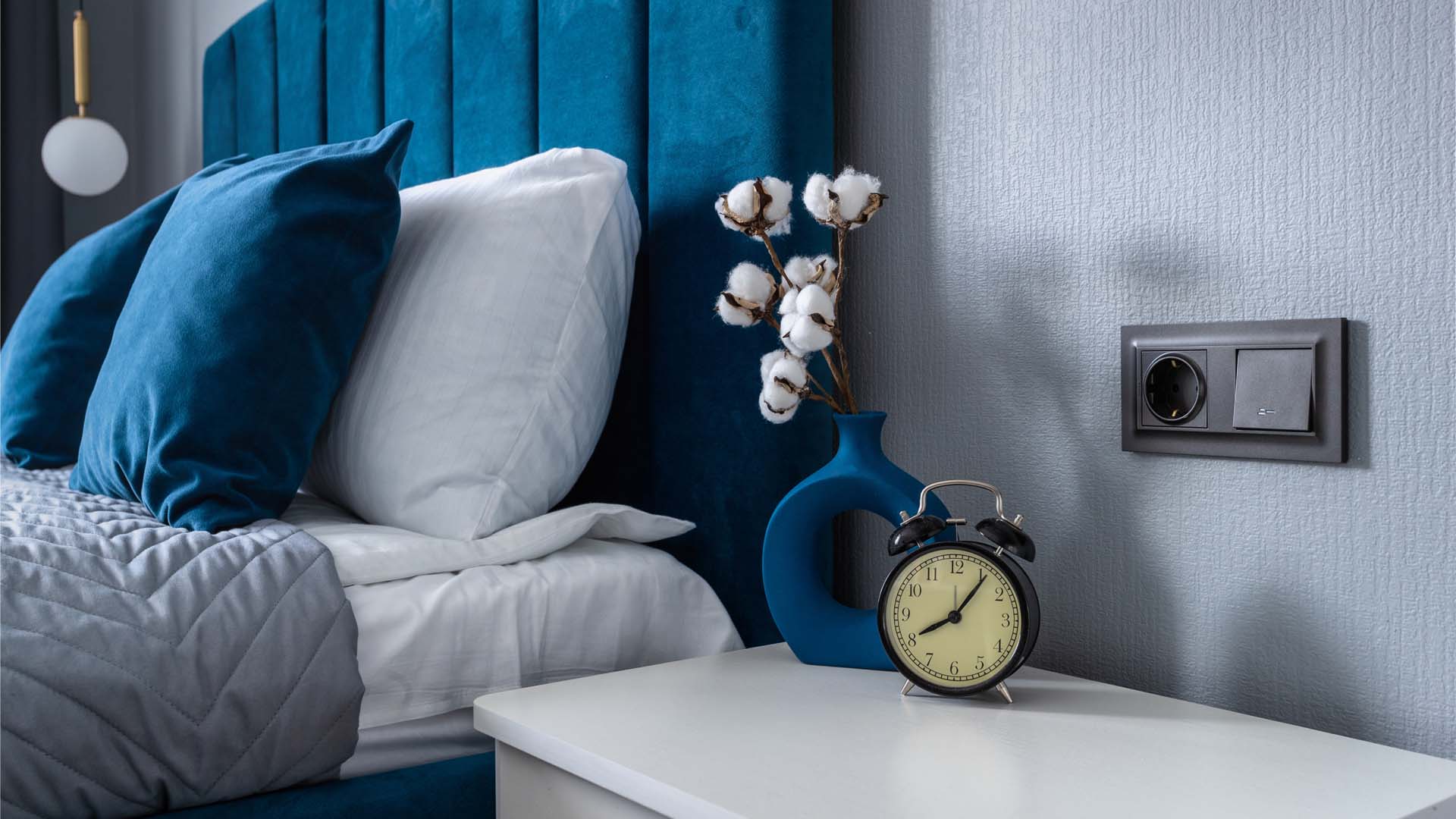 Bedside table with alarm clock