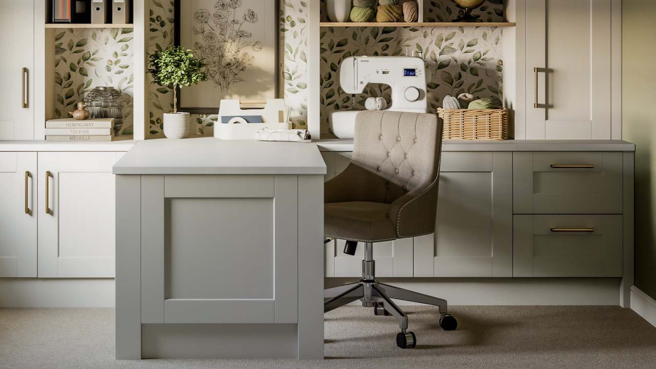 A home office in neutral shades, with built-in cupboards and shelving, and a desk in the centre with an upholstered desk chair