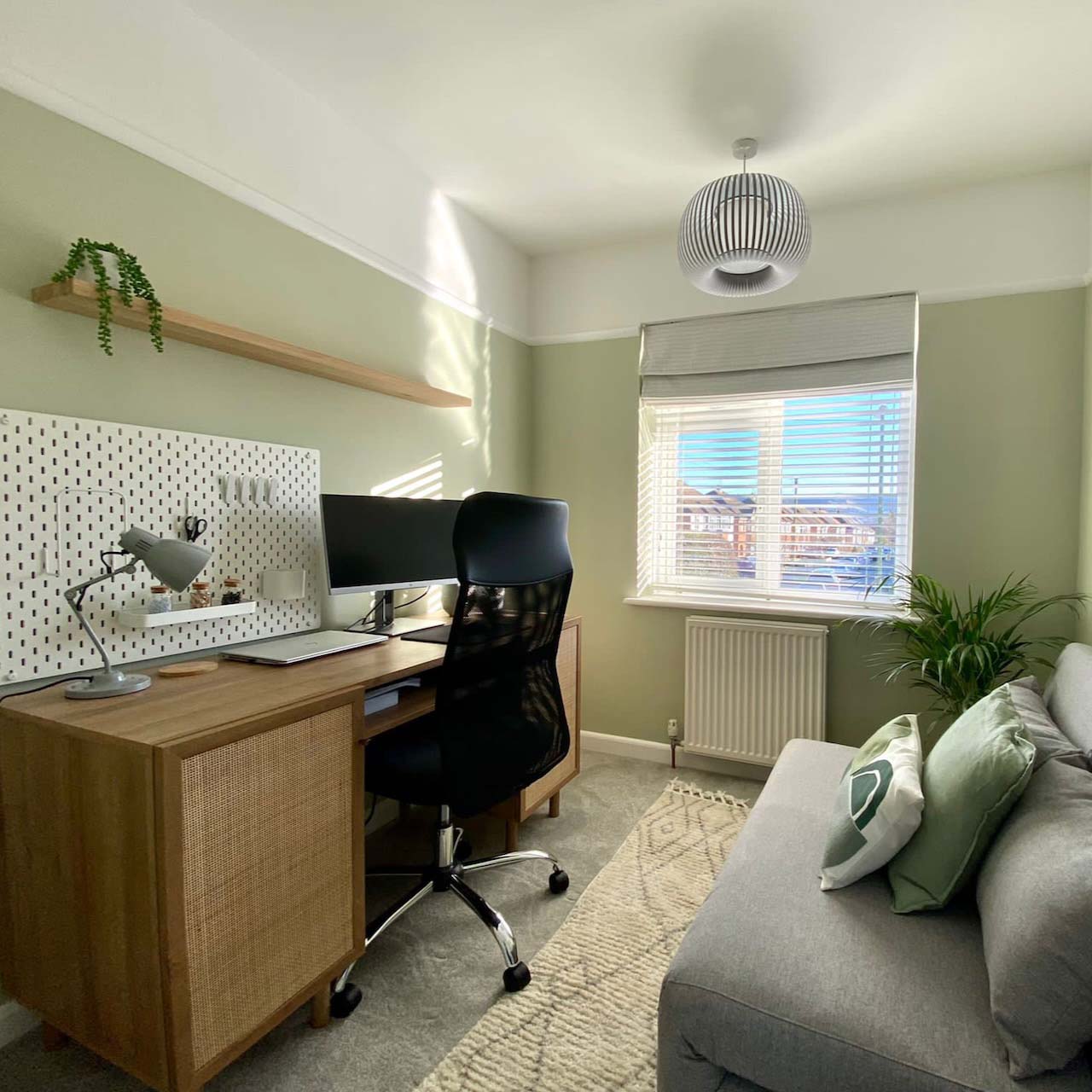 Use a shelf above the desk for more storage and space