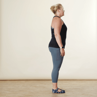 A woman demonstrating a single leg lift